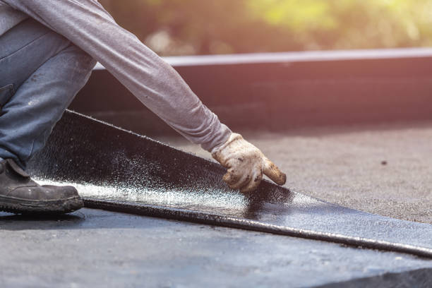 Professional Basement Waterproofing technician working in Lexington, WA